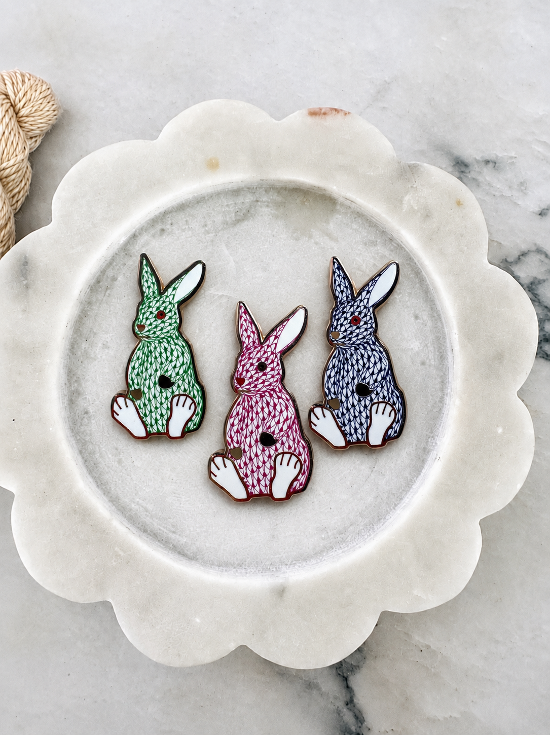 The Palm Bunny trio on a scalloped marble dish